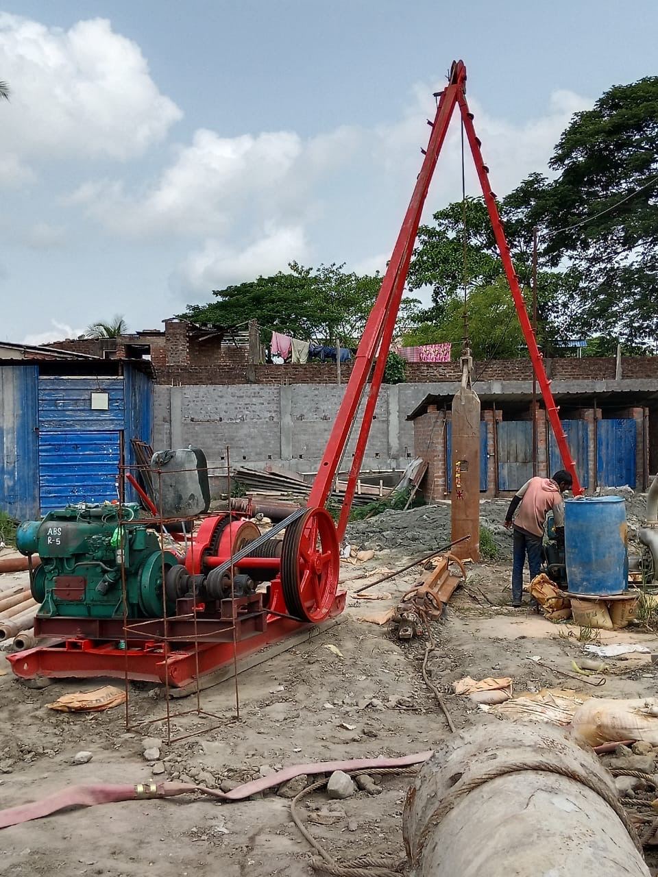 Tripod and winch rig for manual auger boring